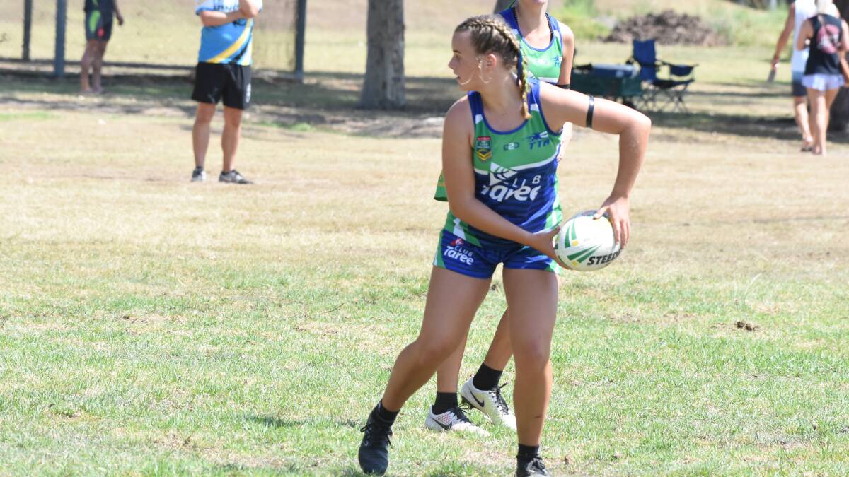 Jess Ferris, playing for Taree under 14s, looking to offload during a match in the Northern Eagles championships. Taree won the division.