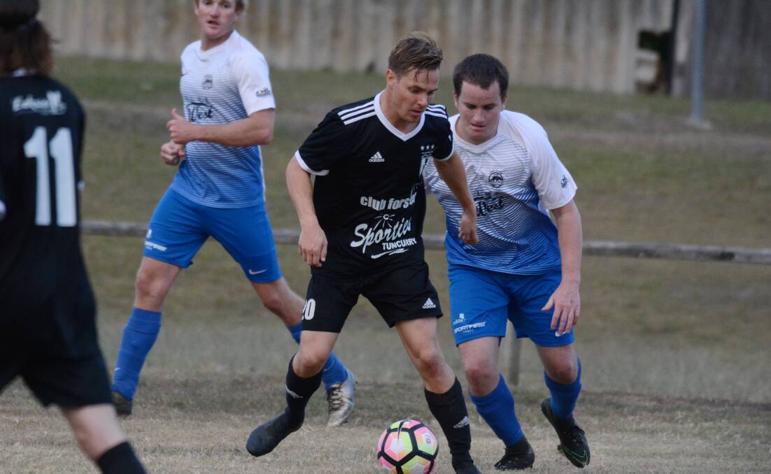 James Somerville from Wallis Lake on the attack against Taree Wildcats this year. Wallis Lake will be one of five Football Mid North Coast clubs involved in the Coastal Premier League from 2020.