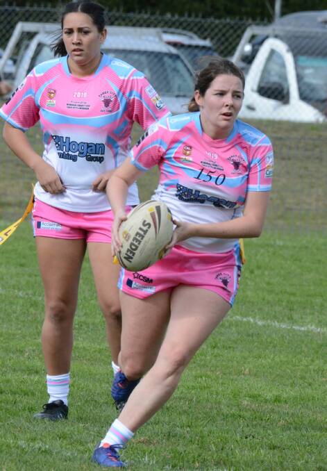 Taree City's Brooke Murray looks for support during the league tag clash against Wingham. This was her 150th game for the club. Taree won 18-6.