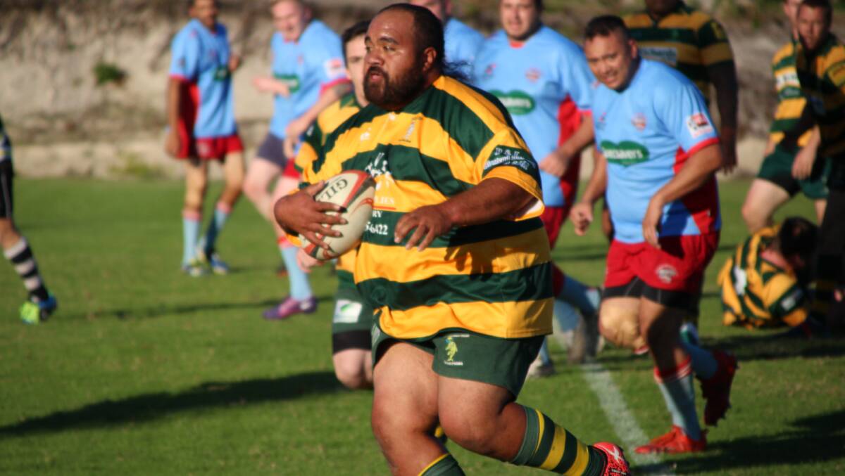  Forster front rower Lorenzo Latu striding out in the match against Old Bar. Photo Sue Hobbs.