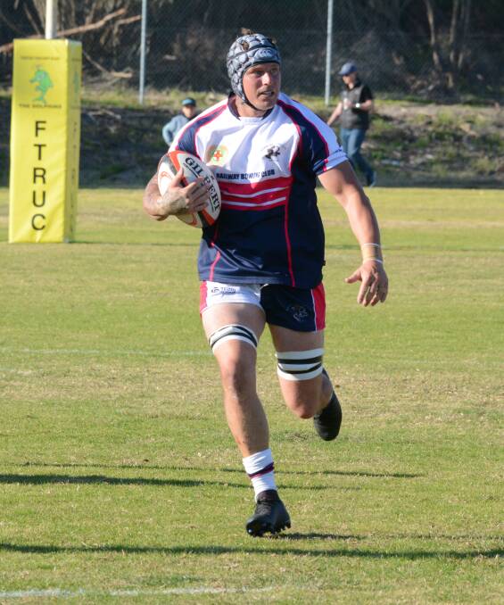 Manning Ratz captain Sam Hartnett charges at the defensive line during last season's grand final. There are fears a knee injury might end his campaign for 2020.
