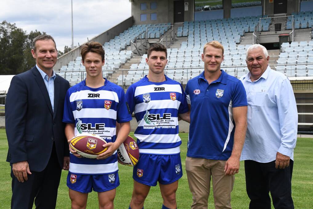 Canterbury chief executive Andrew Hill, North Coast representative players Eli Clark from Forster-Tuncurry and Mitch Evans from Port Macquarie, Bulldogs star Aiden Tolman and Country Rugby League chairman John Anderson at the signing held at Port Macquarie.