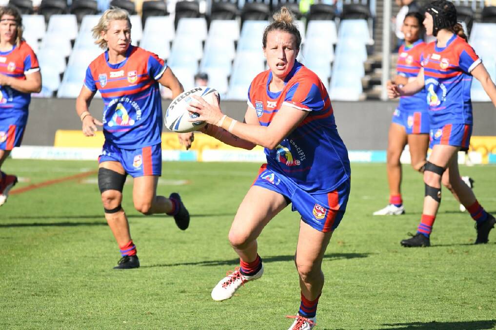 Holli Wheeler playing for CRL Newcastle in the NSW Women's Premiership. Kylie Hilder is in support.
