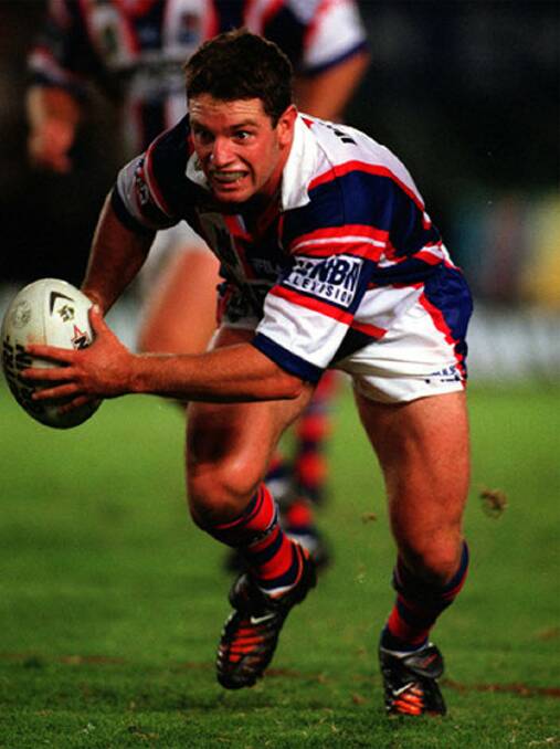 Danny Burderus makes a break playing for the Newcastle Knights.