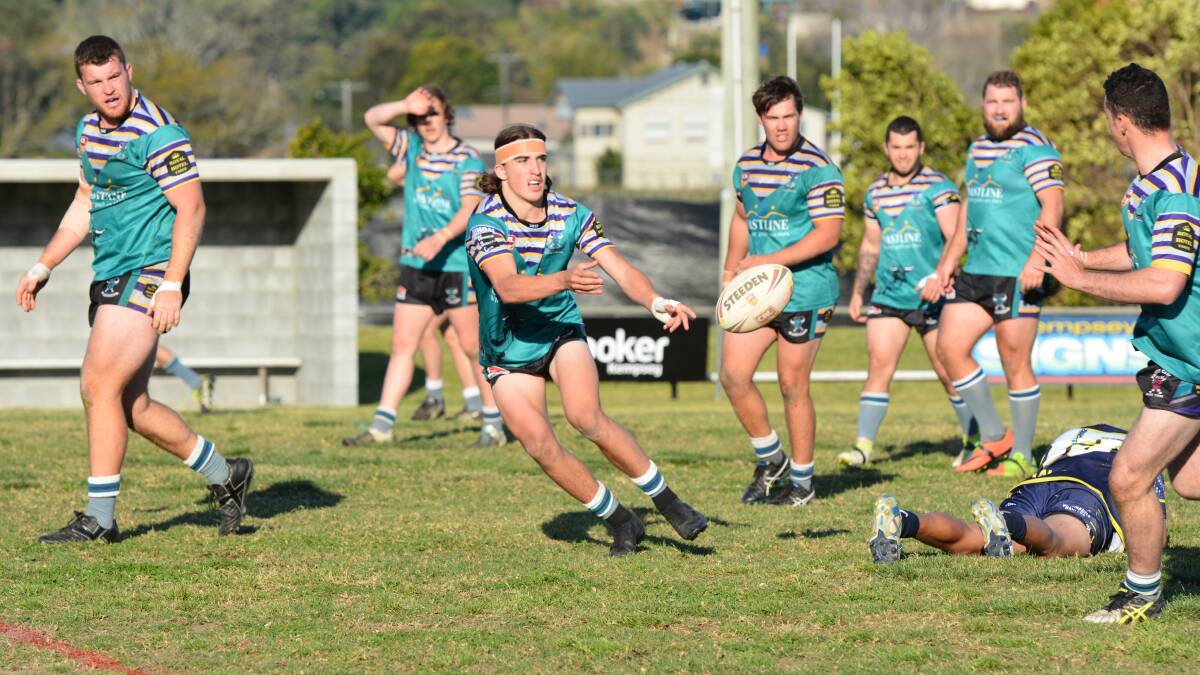Taree's Oscar Carey sends out a pass during the Group Three Rugby League final against Macleay at Kempsey. Macleay won 28-18. Photo Penny Tamblyn Macleay Argus.
