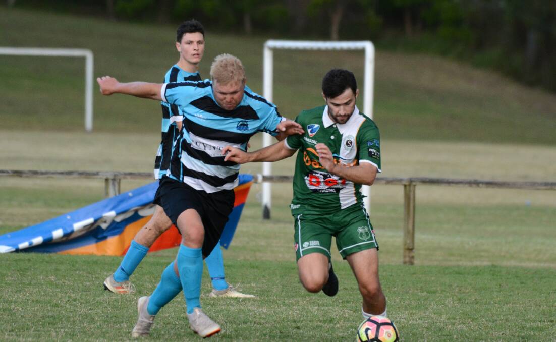Taree's Jackson Witt (left) battles for the ball with a Kempsey Saints opponent during last weekend's clash at Omaru Park.