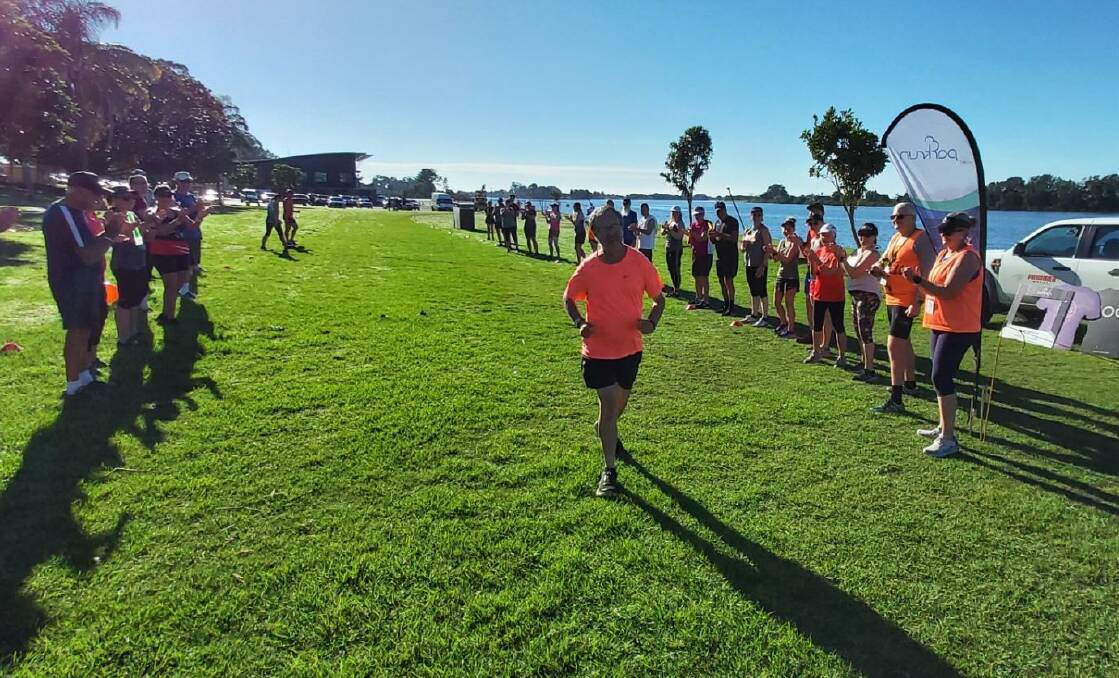 Russell Thornton makes it to the line to complete his 250th parkrun at Taree.