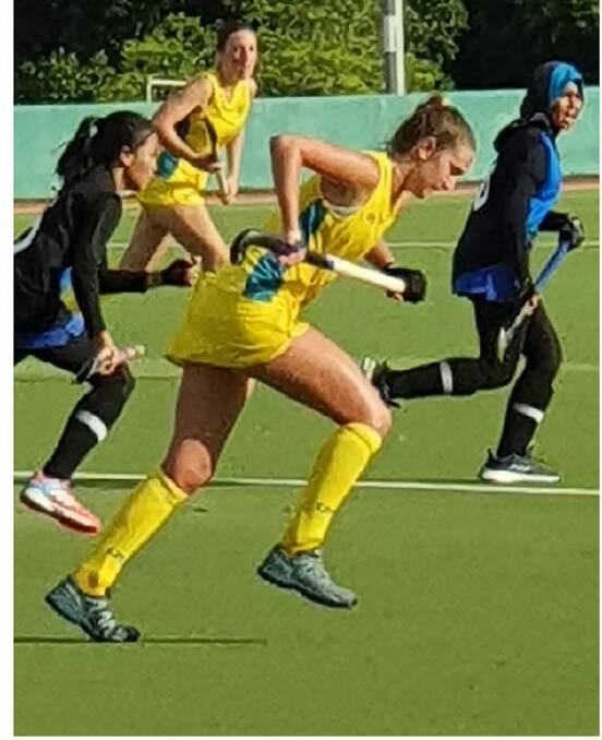 Priya Bourke goes on the attack for the Australian Country under 21 women's side in the opening game of the tour of Borneo.