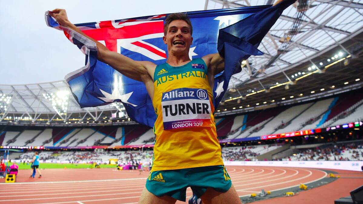 Golden boy: James Turner celebrates after his brilliant win in the 200 metres in London on Tuesday morning.