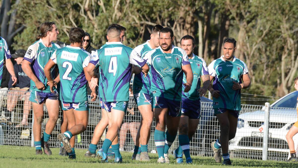 Better times: Taree City celebrate a try during the clash against Wingham. However, the Tigers won 46-22.