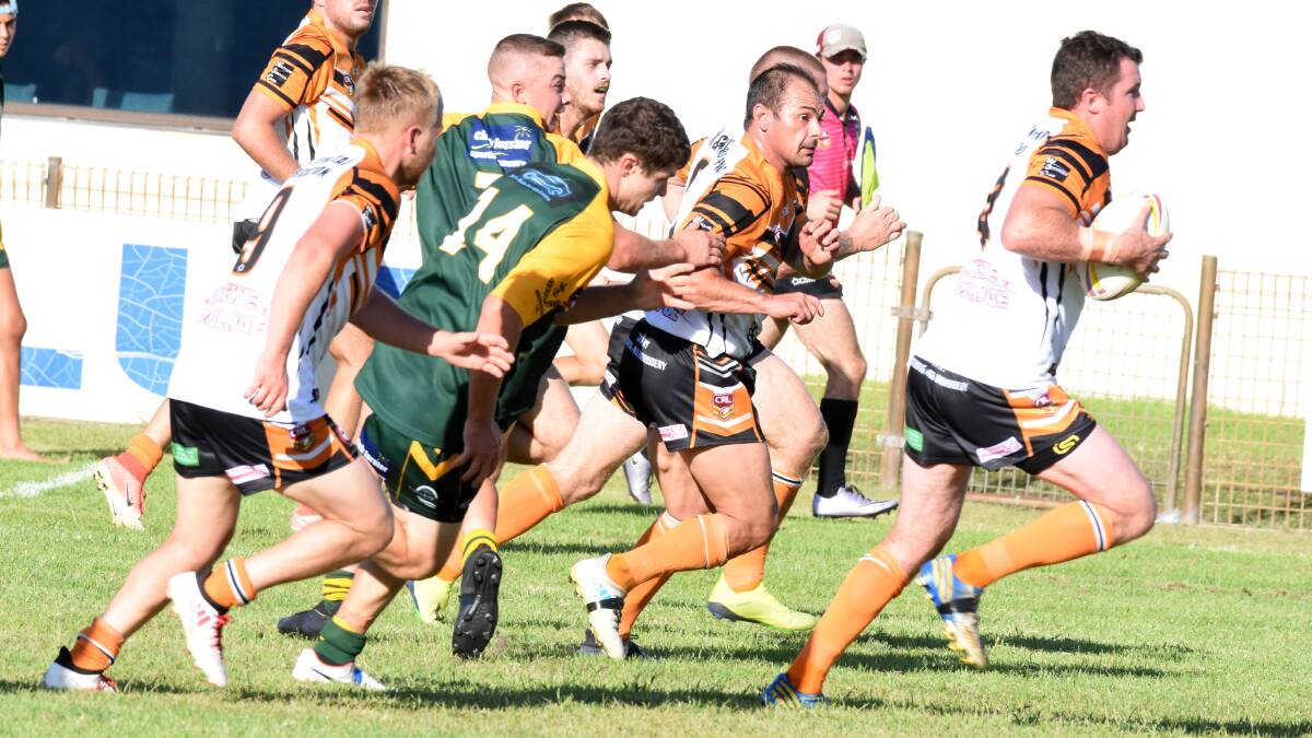 Wingham centre Trent Green races through a gap in the Forster-Tuncurry defence in the opening round clash. He'll miss Wingham's game against Wauchope because of work commitments.