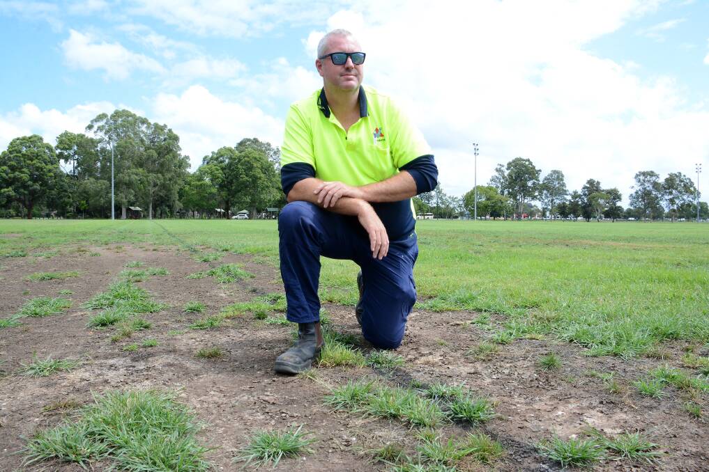 Ben Welsh checks the condition of the rugby league/touch fields at Taree Recreation Ground.