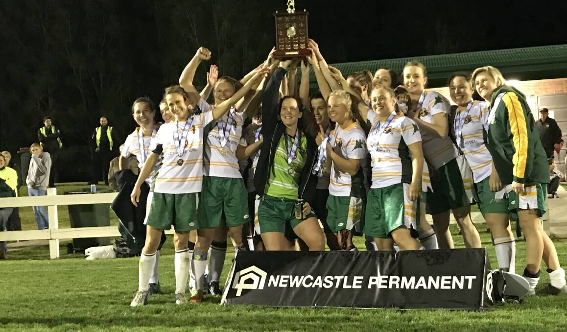 We are the champions: Cundletown Jets players celebrate their penalty shootout win over Tuncurry-Forster in the Southern League women's football grand final. Photo Mim Haigh.