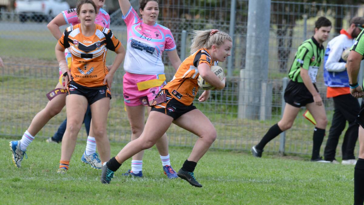 Wingham's Jonty Hemingway makes a run during a league tag clash last year. She also plays in the rugby league nines.