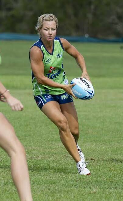 Kylie Hilder looks for support playing in a State Cup touch football match for Taree. 