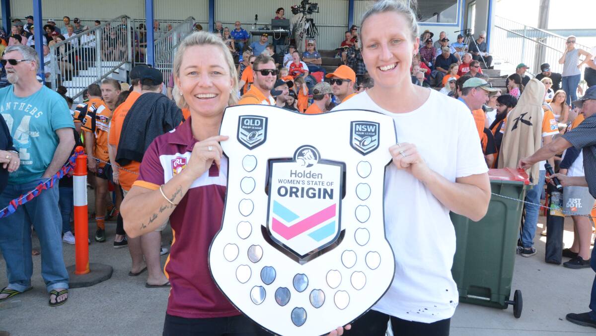 Kylie Hilder (left) and fellow NSW State of Origin representative Holli Wheeler with the State of Origin shield at last year's Group Three grand final, where the shield was on display.