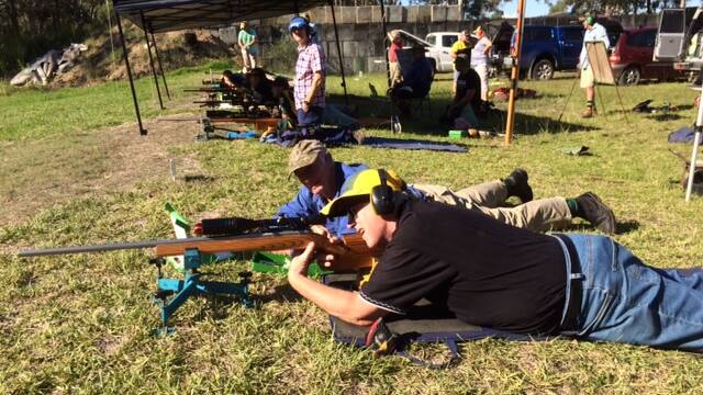 Barry Petrich receives coaching during the round at Wingham Rifle Club.