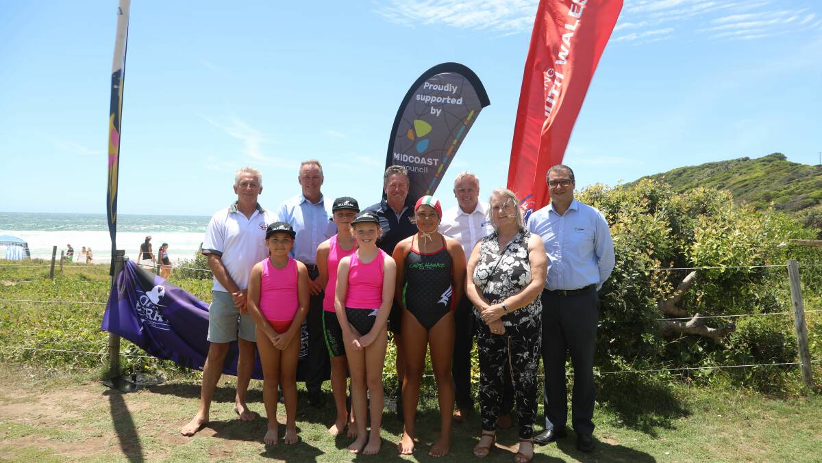 MidCoast mayor Claire Pontin and general manager Adrian Panuccio with Surf Life Saving NSW representatives and Cape Hawk Surf Club nippers at the launch of the Country championships to be held at One Mile this month.