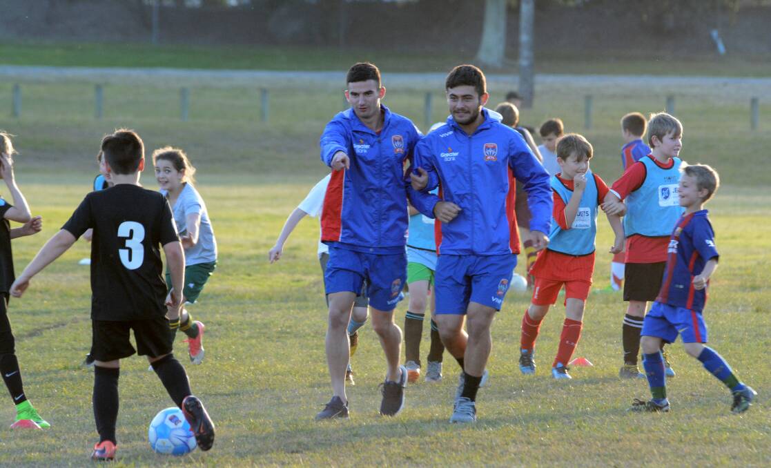 Newcastle Jets stars conduct a coaching clinic in Taree during last year's visit.