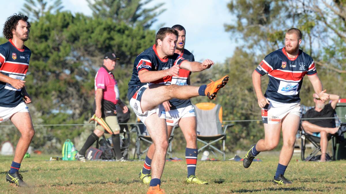 Promising halfback Tanna Hinton puts boot to ball for the Pirates during a clash at Old Bar this season. Old Bar plays Wauchope at Old Bar on Saturday.