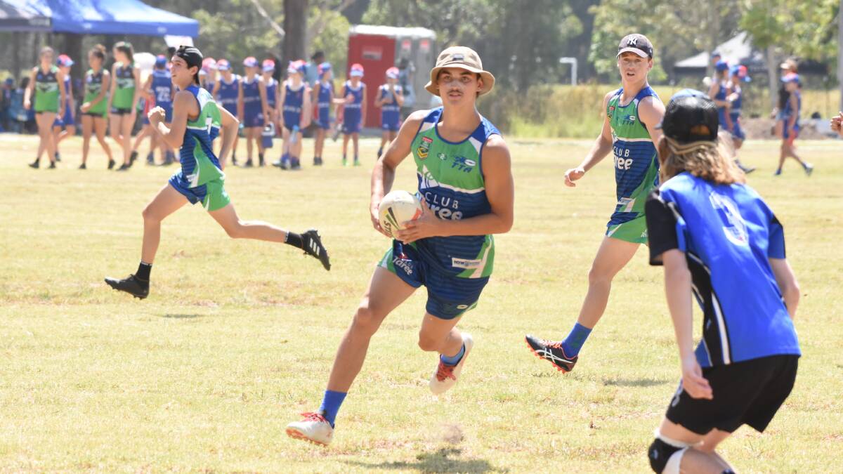 Taree's Jarrad Gibson playing in the Northern Eagles Junior Touch Football Championships at Taree Recreation Centre in January.