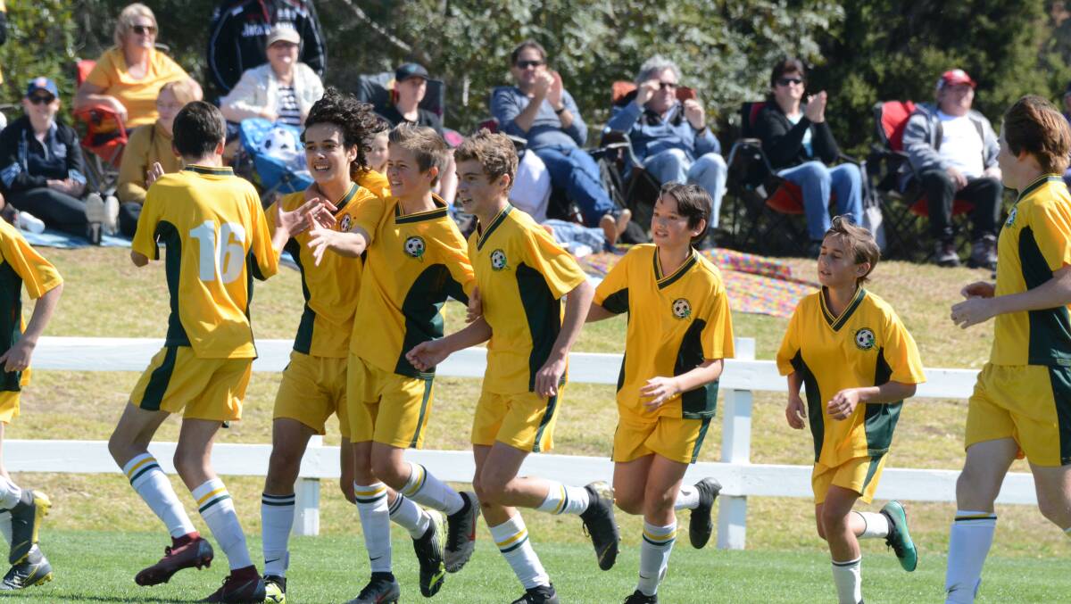 Up the Jets: Cundletown players celebrate after scoring a goal in the Football Mid North Coast Southern League grand final. The Jets play Port United in the zone championship final on Saturday.