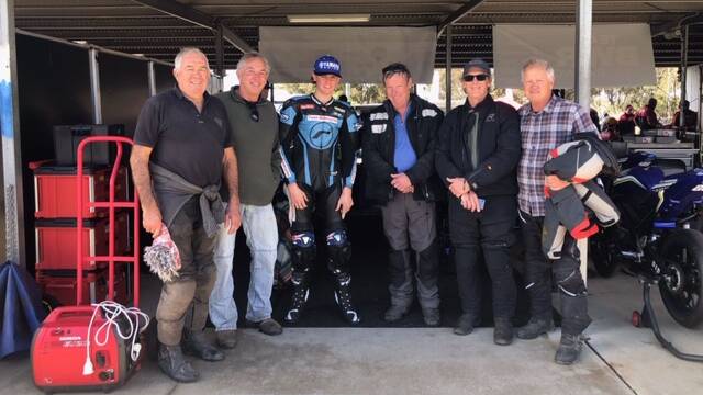 Hayden Nelson with a group of supporters from Taree at the Morgan Park Raceway in Queensland.