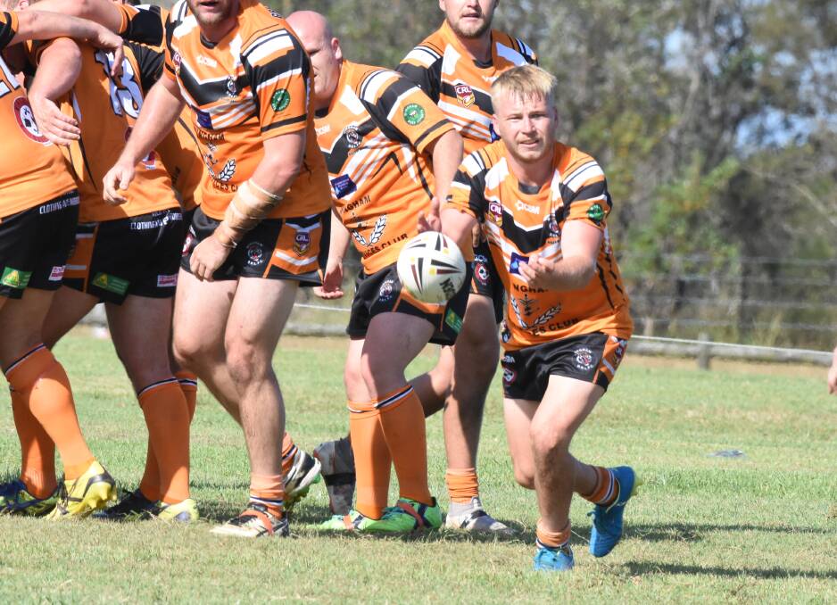 Mitch Collins sends out a pass during the pre-season game against Taree City.