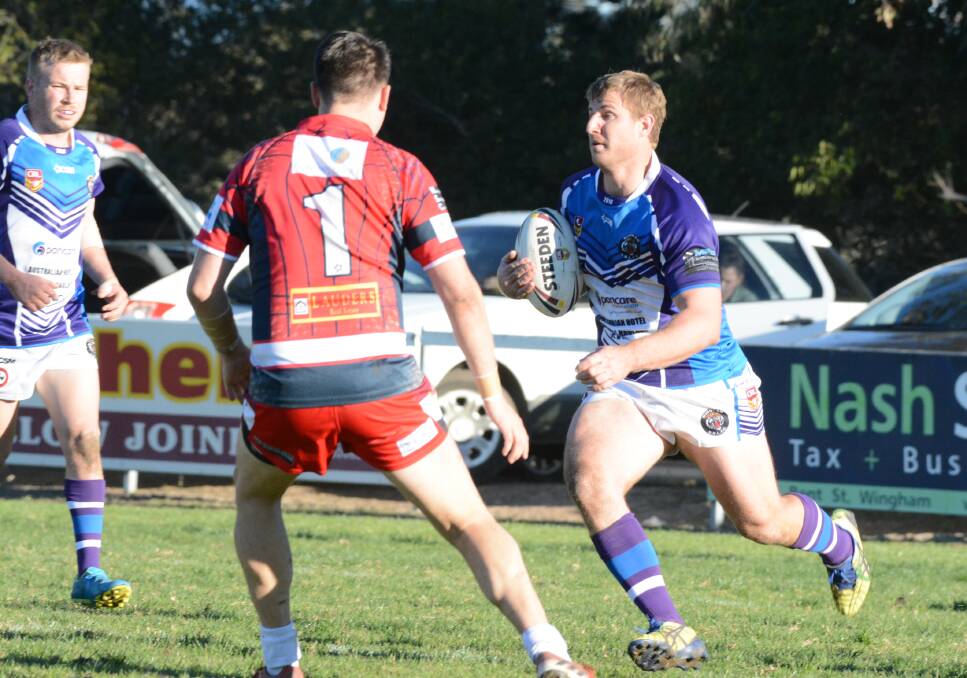 Hard working Wingham lock Brendan Butler carries the ball forward during the clash against Old Bar. The Tigers tackle Taree City on Saturday.
