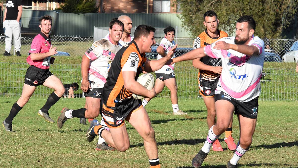 Tim Bridge makes a run against Taree City last year when he made a guest appearance on the Kristylea Bridge Cup day. He returns to the Tigers fulltime this season.