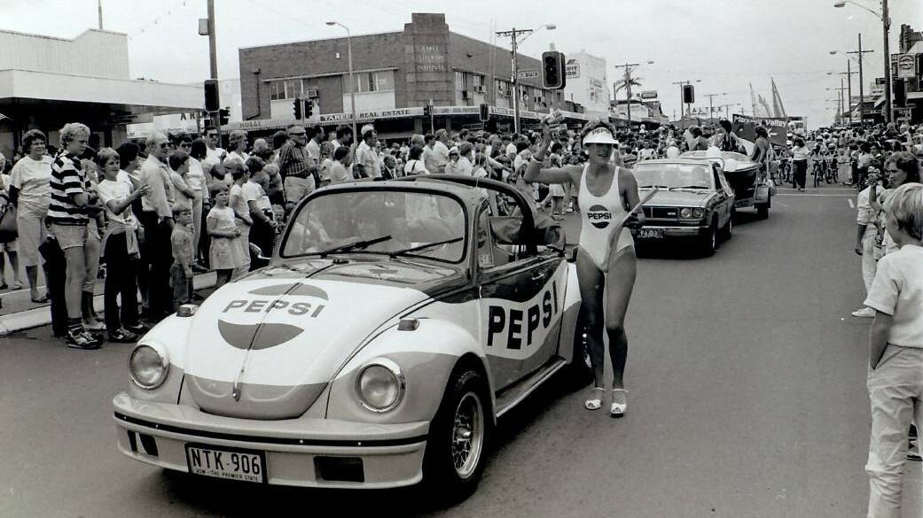 Crowds line Victoria Street for an Aquatic Parade during the 1980s. Being the MC for the event was a job Ted Hill thoroughly enjoyed.