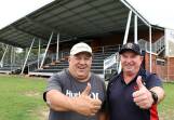 Thumbs upto the new grandstand - Wingham treasurer Craig Martin and president Scott Blanch at the Regional Australia Bank Stadium, the club's newly named home ground. Photo Scott Calvin.