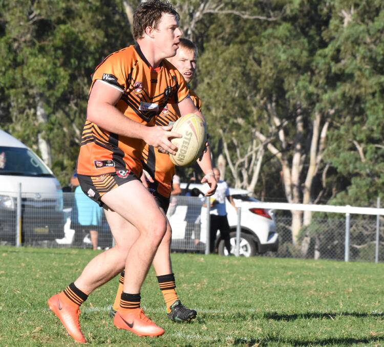Wingham second rower Michael Rees about to take on the Macleay defence during the clash at Wingham. The game was called off at halftime with the Tigers leading 64-0.