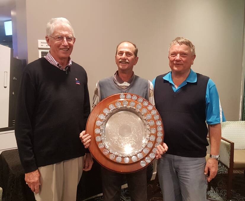 Mal Brooks teamed with Andrew Moore to win the Hammond-Kempe Shield in Taree Golf Club's Springtime Tournament. He is flanked by club captain Peter Wildblood (left) and Geoff Watman representing the sponsors.