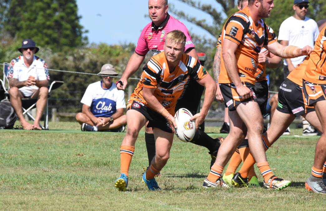 Wingham hooker Mitch Collins about t send out a pass during the opening round of the pre-season at Old Bar. The Tigers will play Old Bar in the southern pre-season final at the Harry Elliott Oval at Tuncurry on Saturday.