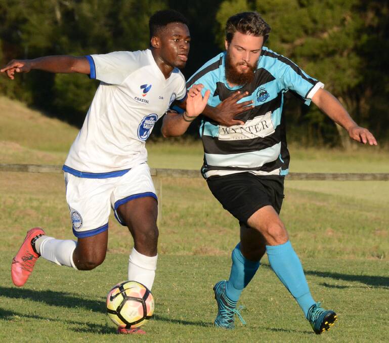 Taree's Jordan Starke battles for possession with a Northern Storm opponent during a CPL clash at Taree earlier this year.