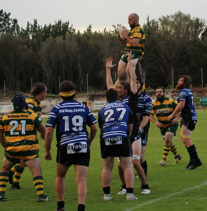 Tom Harris goes high to win a lineout in the Lower North Coast Rugby Union clash against Wallamba. Forster won 43-10. Photo Sue Hobbs.