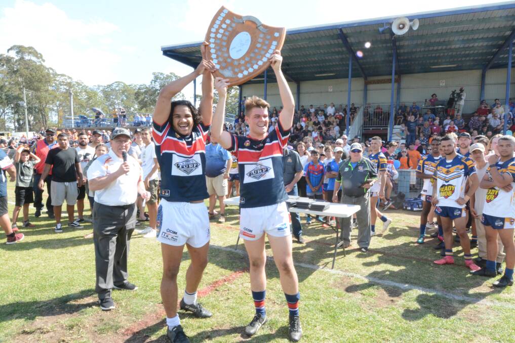 Old Bar players celebrate after winning last season's Group Three under 18 grand final against Macleay Valley.