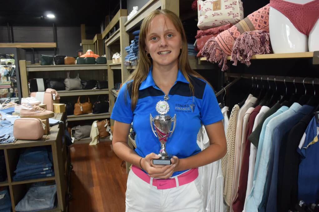 Taree golfer Quedesha Golledge with the trophy she won for taking out the 14/15 years scratch at the Jack Newton Junior Golf tournament in Wagga. She has now qualified for the champion of champions to be played at Bonville in December.