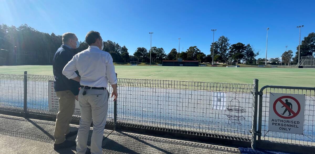 Member for Myall Lakes Stephen Bromhead and Manning Hockey Association president Tony Barton inspect the Terry Launders Field.
