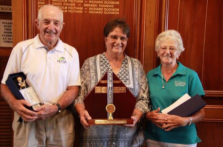 Pam Saddler representing sponsor Manning Great Lakes Skin Cancer Clinic flanked by men's winner Frank Musgrave from Muree and women's winner Betty Andrews from Kew.