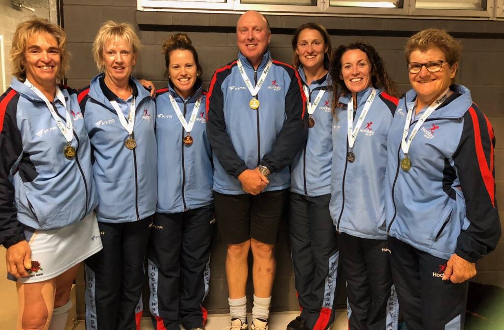 Medal haul: Manning hockey players and coach Tony Lewis with their medal following the presentations at the Australian Masters championships on the Gold Coast (feom left) Linda Ferguson, Lyn Hinton, Kerrie Davy, tony Lewis, Kristy Aldridge, Melissa Mendham, Kate Ryan.