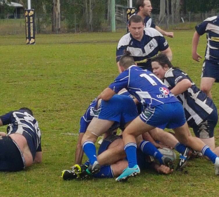 Manning Ratz and Wallamba players battle for the ball during the Lower North Coast Rugby Union clash at Nabiac. Wallamba won 27-0.