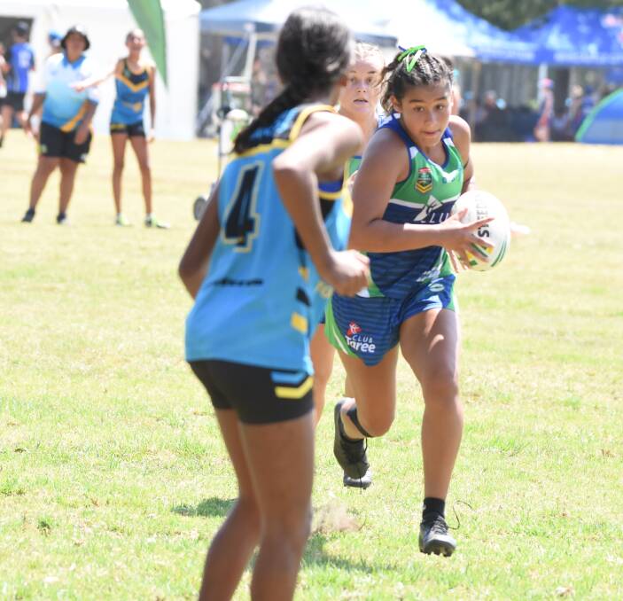 Amarley Bron makes a break for Taree under 14s during the Northern Eagles junior championships played at Taree last January.