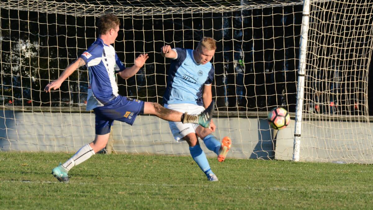 Taree's Jackson Witts clears the ball during the clash against Macleay Valley. Witts is a member of the Football Mid North Coast Southern selection side to play the Newcastle Jets next Tuesday night in Port Macquarie.