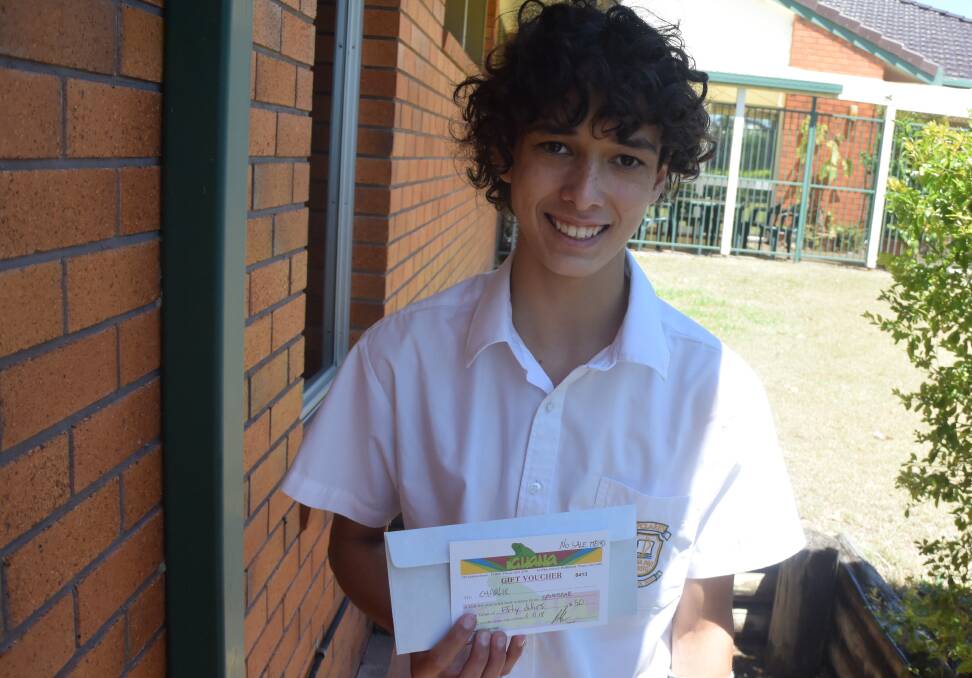 Charlie Pitt with his $50 open order from Iguana for winning the sportstar of the week award.