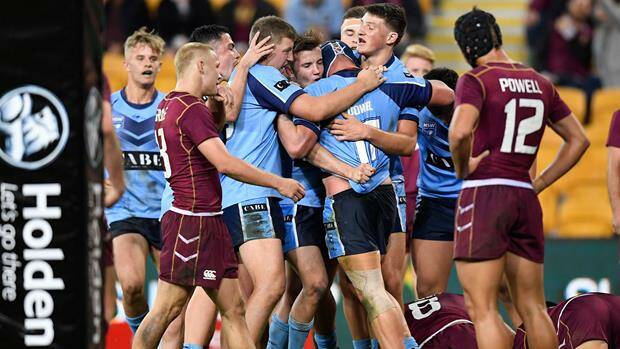 NSW under 16s celebrate their win over Queensland in the under 16 encounter.