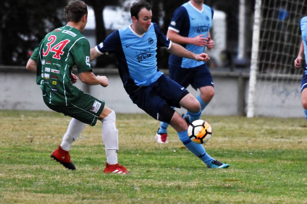 Taree's Ricky Campbell on the ball in the recent clash against Kempsey Saints. Taree tackles Camden Haven at Laurieton on Saturday.