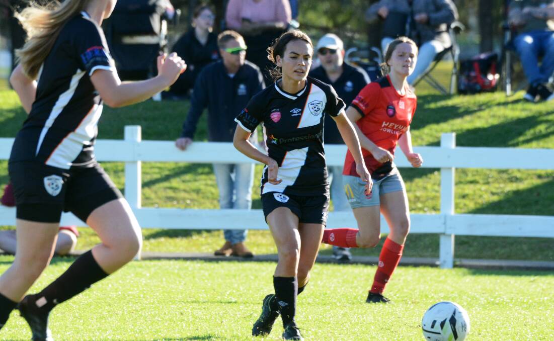 Courtney Anderson goes on the attack for Mid Coast Football in a Herald Women's Premier League game this season.