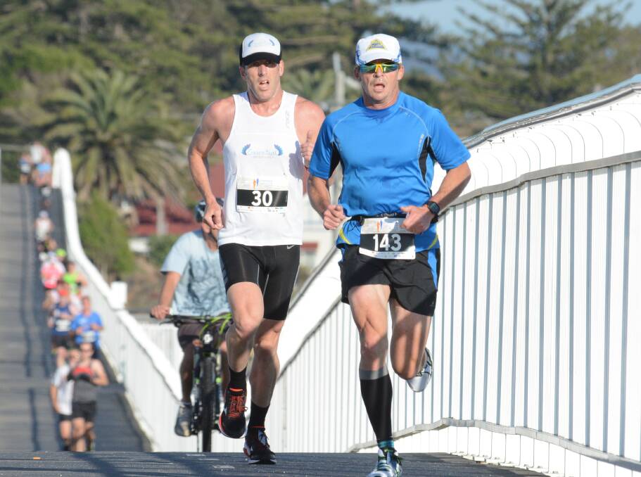 Richard Sewell motors along the Forster-Tuncurry bridge during the Forster Running Festival 2015, just before an accident while training on his bike ruled him out of competition for three years.